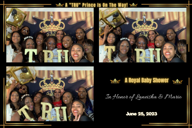 A group of people posing for a photo at a baby shower with a digital photo booth rental.