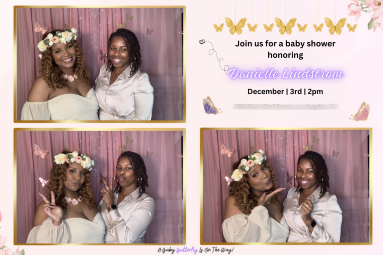 A baby shower photo booth with two women posing for the camera.